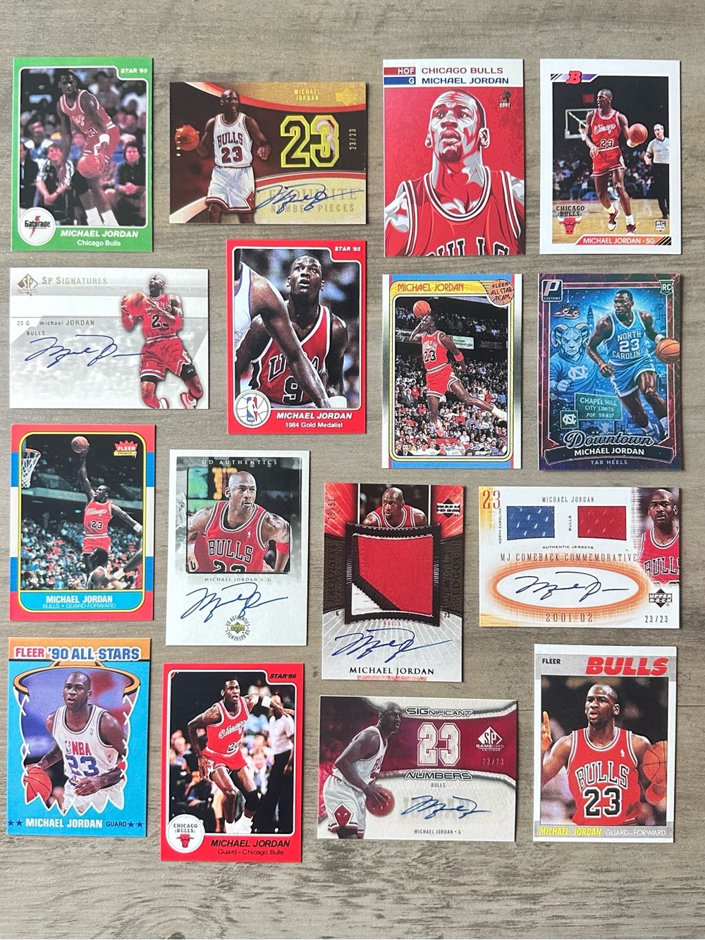 Michael Jordan Signed Rookie Lot of (16) Star UD Starting Lineup Novelty Cards.